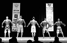 Top 5 Men's Physique Master competitors on stage at the 2014 NPC Jay Cutler Classic, John Quinlan #208 (far left) 2014 NPC Jay Cutler Classic Men's Physique Model John Quinlan (far left).jpeg