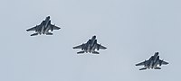 A formation of three F-15C/D Eagles overhead Kadena Air Base in Okinawa, Japan. The aircraft are assigned to the 18th Wing.