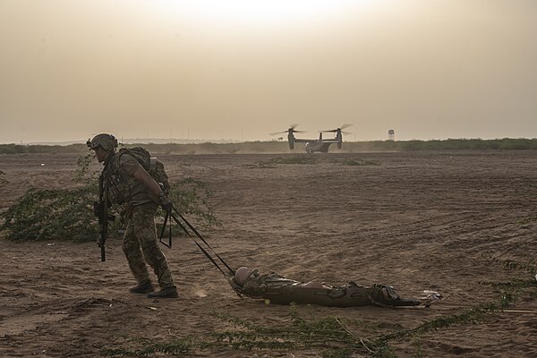 A pararescueman from the wing's 82nd Expeditionary Rescue Squadron drags a litter during an exercise in Djibouti, 2023