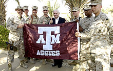 US Secretary of Defense Robert Gates gives a gig 'em with a group of Aggie Marines at Camp Fallujah, Iraq Aggies-CampFallujah Robert-Gates.JPEG