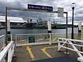 Ramp leading towards the wharf. Passengers getting off at Aquarium have a right-of-way, as signalled by the "No entry" sign and arrows on the ramp itself.