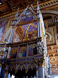 The ciborium over the high altar of St. John Lateran is derived from a design by Arnolfo di Cambio and decorated with paintings by Barna da Siena in 1367–1368. The cage above contains silver reliquaries which are said to hold the heads of SS. Peter and Paul.