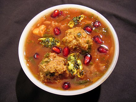 A bowl of ash-e anar, an Iranian soup made with pomegranate juice