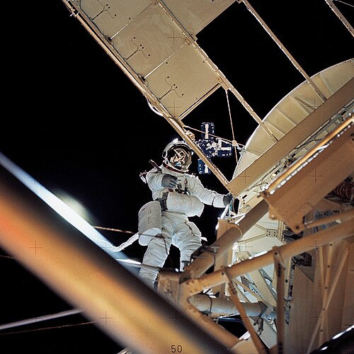 Astronaut Owen Garriott working next to Skylab's crewed solar space observatory, 1973