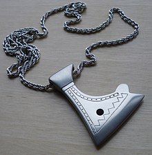 Modern day "Axe of Perun" amulet based on a finding from the Khazar fortress Sarkel (Sarkel), excavated in the 1930s. The Kievan Rus' controlled the fortress from 965 until the 12th century. Axe of Perun.jpg