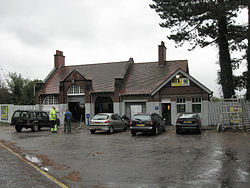 Brackley Central station forecourt in October 2008, the building now used by a tyre firm. Brackley Central Station Forecourt, October 2008.jpg