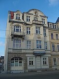 Apartment building in half-open development