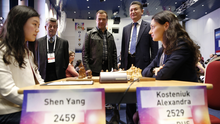 FIDE president Kirsan Ilyumzhinov (right), awaiting the second round. Chess Championship 2015 (Women).png