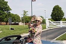 2022 New Albany Founders Day Grand Marshal Colleen Briscoe waves from a car during the parade.