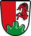Gemeinde Hammel Gespalten von Rot und Silber; hinten der Rumpf eines roten Steinbocks, im Schildfuß ein grüner Dreiberg.