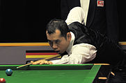 Deutsch: Bild aufgenommen in Berlin während des German Masters im Snooker 2014. Dechawat Poomjaeng. English: Picture taken in Berlin during the Snooker German Masters in 2014. Dechawat Poomjaeng.