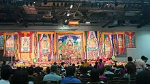 Thangkas on the wall during a Tibetan Buddhist puja Drophenling 2015Puga.jpg