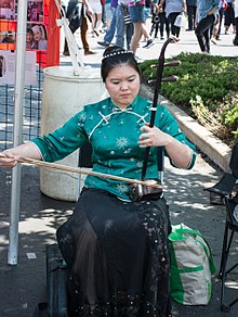 An erhu player performs at the 2016 Cleveland Asian Festival. Erhu player - Asian Fest 2016 (28523535036).jpg