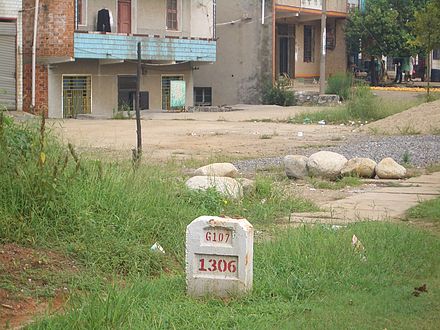 A typical milestone (1306 km from Beijing) on National Highway 107