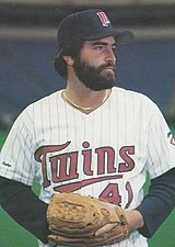 Minnesota Twins pitcher Frank Viola (16) speaks with Twins Gary Gaetti (8)  as the St. Louis Cardinals celebrate at home plate in the fourth inning of  game 4 of the World Series