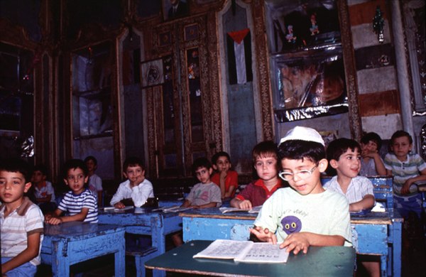 Jewish pupils in the Maimonides school in 'Amārah al Juwwānīyah, in the historic Maison Lisbona in Damascus. The photo was taken shortly before the ex