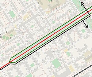It is possible to make turns (black lines) only from the side roads (Russian: карманы, green lines, mapped as side_road=rotary). Turns from main carriageway (red line) are prohibited.