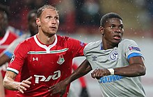 Embolo challenging with Benedikt Howedes of Lokomotiv Moscow in October 2018 Loco-Shal04 (3).jpg