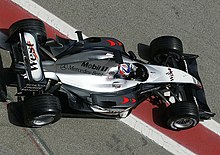 The McLaren MP4-18 driven by Kimi Räikkönen exiting the garage for testing
