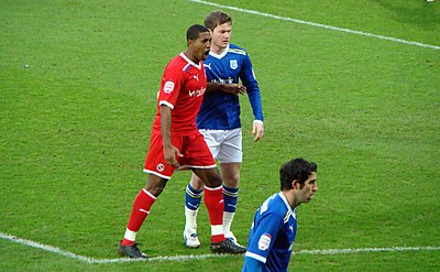 Leigertwood being marked by Cardiff City's Aron Gunnarsson during the Cardiff City and Reading match on 2 January 2012. Mikele Leigertwood, 02 01 12.jpg