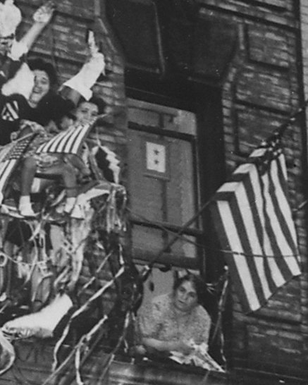 File:Mother with two sons in the US Armed Forces watches others celebrate V-J Day, from- Americans of Italian descent in New York City wave flags and toss paper into the air as they celebrate- NARA - 535794 (cropped).tif