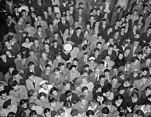 A crowd of young people at the concert of the Benny Goodman Band at a local dance hall. April 1940 Oakland, California. Hot Jazz Recreation. A crowd of young people at the concert of the Benny Goodman Band which took... - NARA - 532264 (cropped).jpg