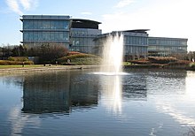 View of Oxford Science Park. Behind the fountain is the Gosling Building - headquarters to Oxford Nanopore Technologies, and to the right is the Sherard Building, offices both built in 2002. Oxford Science Park - geograph.org.uk - 661237.jpg
