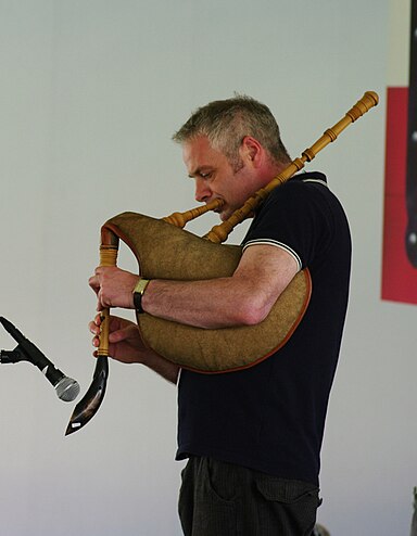 Ceri Rhys Matthews playing a Welsh Bag-Hornpipe or Pibe Cyrn Pibecyrn.jpg