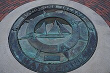 Bugeye pictured on a visitors' wayfinding compass on Solomons Island Place marker of Solomon Island, Maryland.JPG