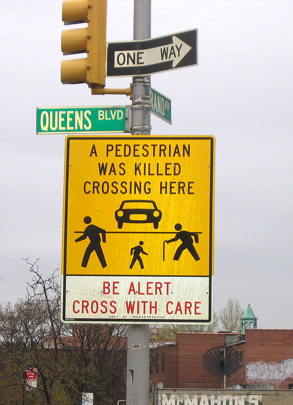 "A Pedestrian Was Killed Crossing Here" sign on Queens Boulevard at Grand Avenue in Elmhurst