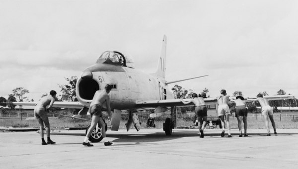 RAAF ground crew pushing a Sabre before it took off from Ubon in 1965