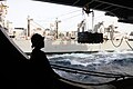 Moving pallets into the hangar of a Nimitz-class carrier