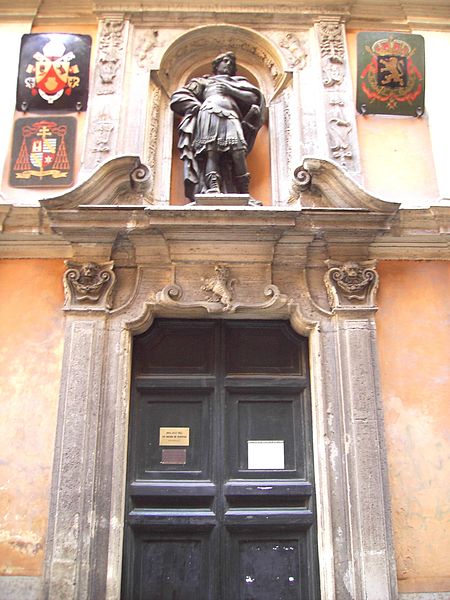 Door of San Giuliano dei Fiamminghi: Arms of Pope Benedict XVI and arms of titular bishop (Jan Pieter Schotte) on the left, arms of Belgium on the rig