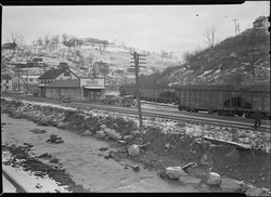 Coal cars by The Shack Community Center in the 1930s Scott's Run, West Virginia. The Shack Community Center - Scene is typical of crowded space. In center of valley the... - NARA - 518374.tif