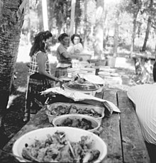 Seminoles having a Thanksgiving meal in the mid-1950s Seminole Indian Thanksgiving Meal (5184648544).jpg