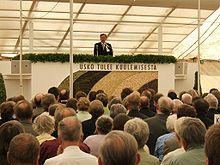 A speaker and older listeners at Summer Services in Perho, Finland 2005 Seurat suviseuroissa.jpg