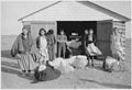 Seven women with bags of wool - NARA - 285219.jpg