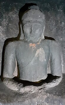 Buddhist sculpture in the caves Statue in Vijasan cave.jpg