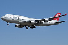 The improved 747-400, featuring canted winglets, entered service in February 1989 with Northwest Airlines The Boeing 747 (3441131089).jpg