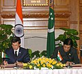 The Deputy Chairperson of the Cabinet of Ministers and Minister of Foreign Affairs of Turkmenistan, Mr. Rashid Meredov and the Minister of State for External Affairs, Shri E. Ahammed signing the agreement, in New Delhi.jpg