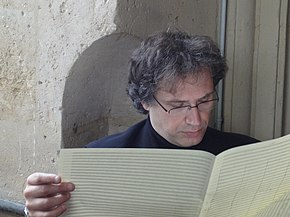 Thierry Escaich analysing a manuscript in 2011 Thierry Escaich compositeur et organiste.jpg