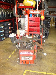 Tire changer Machine used to help tire technicians dismount and mount tires with automobile wheels