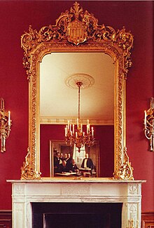West wall of the Treaty Room during the Clinton administration showing the overmantel mirror. TreatyRoomMirrror.jpg