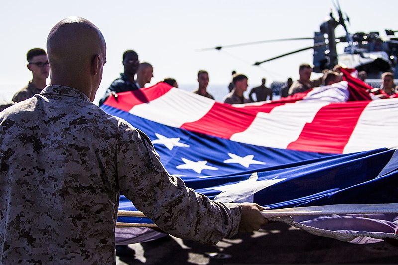 File:U.S. Marines and Sailors assigned to the 26th Marine Expeditionary Unit (MEU), and Sailors assigned to the USS Kearsarge (LHD 3), fold the American flag to commemorate the Fourth of July during their 2013 130704-M-BS001-008.jpg