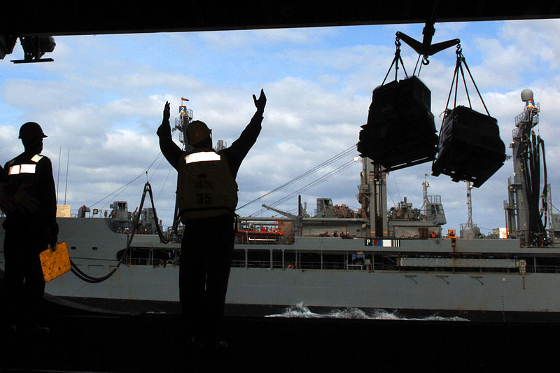 File:US Navy 070326-N-7090S-002 Boatswain's Mate 3rd Class David Williams from Memphis, Tenn., guides pallets from Military Sealift Command (MSC) fleet replenishment oiler USNS Big Horn (T-AO 198) to nuclear-powered aircraft carrier.jpg