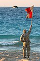 US Navy 091011-M-8752R-118 A naval beach master guides a landing craft utility ashore during Exercise Bright Star 2009 in Egypt.jpg