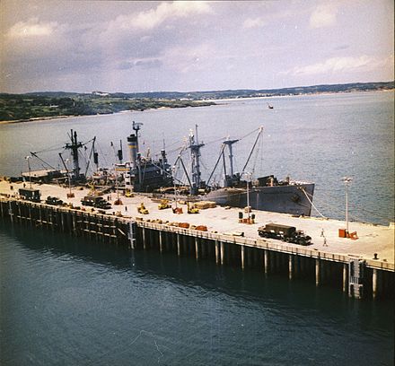 USNS Private Francis X. McGraw is loaded with chemical weapons at Tengan Pier, Okinawa during Operation Red Hat in September 1971 19-31-2 Tengan pier.jpg