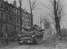 B Company of 644th Tank Destroyer Battalion, attached to the 8th Infantry Division, move into Duren on 24 February 1945. 1st Allied Armor Crossing Roer River at Duren, German - Feb 24 1945.jpg