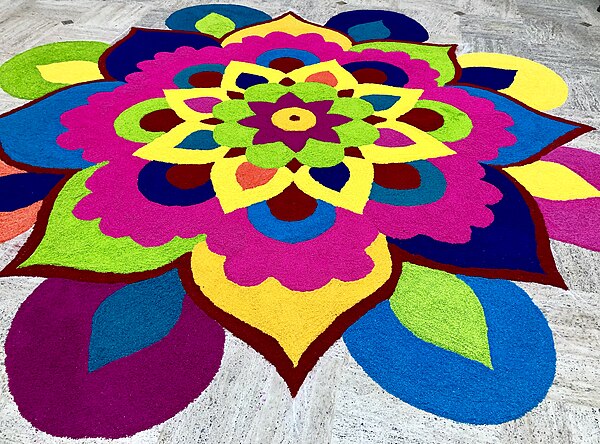 Tamil people decorate their homes with various auspicious colorful geometric designs from rice powder called Kolam.