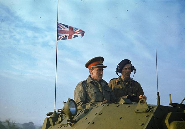 The Commander in Chief Home Forces, General Sir Bernard Paget (left) and Dempsey (right) watch 42nd Armoured Division exercises from a Crusader tank.